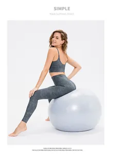 Close-up of high-waist yoga set with grey marble pattern fabric and elastic texture
