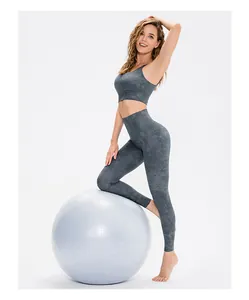Detail of high waist marble pattern yoga leggings with matching sports bra on model