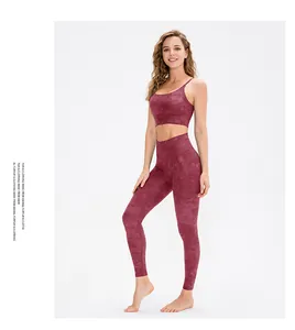 Detail of high-waist yoga set with burgundy marble texture and sleek elastic fabric