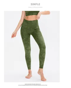 Detail of high waist yoga leggings and crop top with green marble texture pattern