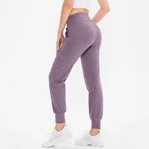 Damen Yoga-Jogginghose mit hoher Taille in Staublila, Seitentaschen und Elastikbündchen