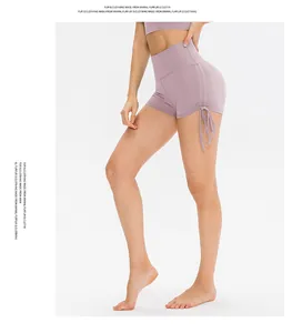 Detail of high-waist lilac yoga shorts featuring side drawstring and ruched texture