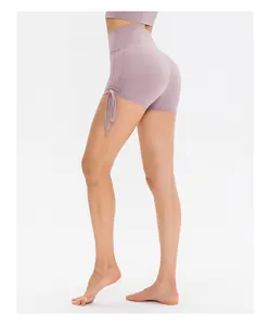 Detailed side view of high-waisted yoga shorts featuring adjustable drawstring ruched sides