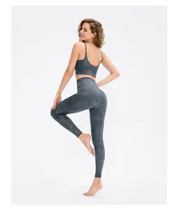 Close-up of dark grey marble print high-waisted yoga leggings with elastic fit fabric