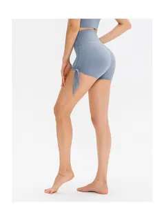 Detail of high-waist yoga shorts in misty blue with adjustable side drawstrings