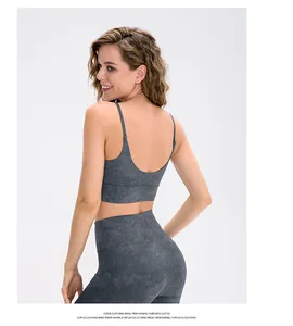 Detail view of high-waist marble print yoga set with supportive criss-cross sports bra