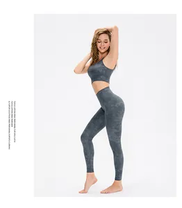 Detailed side view of high-stretch printed yoga set with marble pattern and sports bra