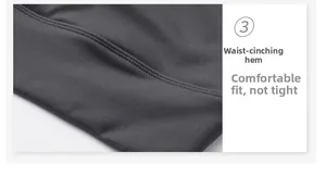 Close-up of the waist-cinching hem on dark grey yoga bra with double-stitched seams
