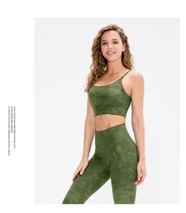 Detail of high-stretch yoga bra with marble texture and soft moss green finish