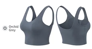 Detail view of the gray-blue sports bra showing the U-shaped back and side shaping seams