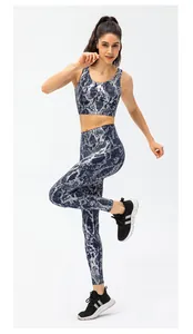 Macro detail of snake print high waist yoga leggings with metallic sheen fabric