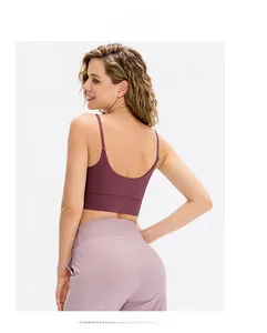 Close-up of deep purple racerback sports bra with breathable elastic yoga fabric