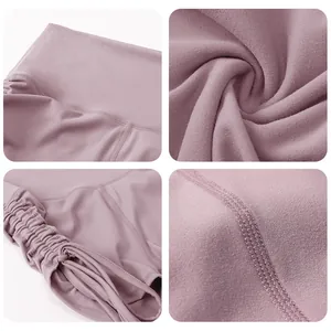 Detail view of high waist yoga shorts with drawstring sides and flatlock stitching