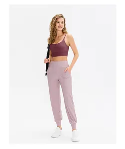 Detail view of high-waist joggers with side pockets and breathable sports bra set