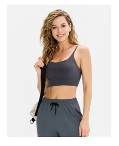 Detail of high-stretch dark grey yoga set featuring racerback top and drawstring joggers