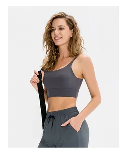 Detail of grey sports bra and drawstring joggers with side pockets for fitness wear