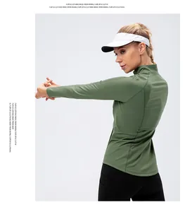 Detailed back view of an olive green slim fit long sleeve yoga jacket with a stand collar