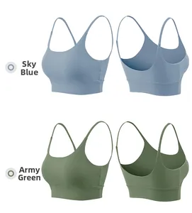 Flat lay view of seamless sports bra in light blue and army green with thin straps