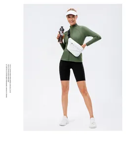 Close-up of grass green zip-up sports jacket with stand collar and breathable fabric