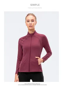 Detail shot of a slim fit maroon yoga jacket featuring a stand collar and full zipper closure