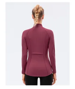 Detail view of burgundy slim fit yoga jacket with flatlock stitching on the back