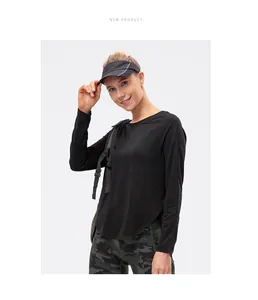 Détail du t-shirt de sport noir à manches longues avec tissu respirant et ourlet arrondi