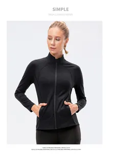 Close-up of women's black yoga jacket with stand collar and sleek zipper detail