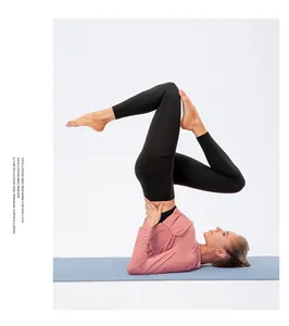 Detail of female yoga set showing long sleeve top and leggings with side pocket