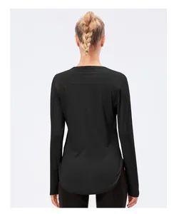 Detail of black UPF50+ yoga shirt showing breathable fabric and curved back hem design