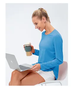 Detail of light blue sun protection yoga top with side slits and breathable fabric