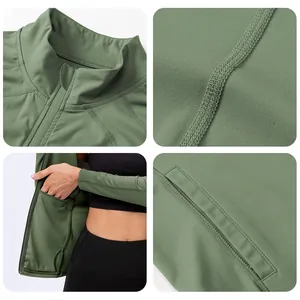 Detail view of stand-up collar, seamless stitching, and hidden pockets on yoga jacket