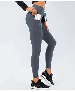 Detail of high-waist yoga leggings with adjustable drawstring and functional side pocket