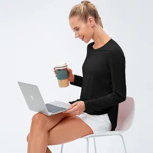 Women's UV protection long sleeve yoga shirt in black with a loose fit and breathable fabric
