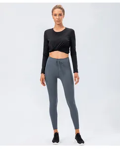Detail of greyish blue yoga leggings with adjustable drawstring waist for fitness workout