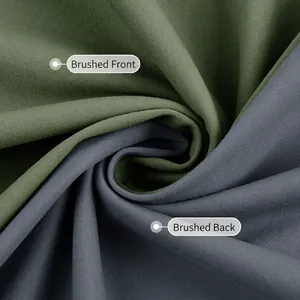 Yoga pants fabric detail showing double-sided brushed texture in olive green and dark grey