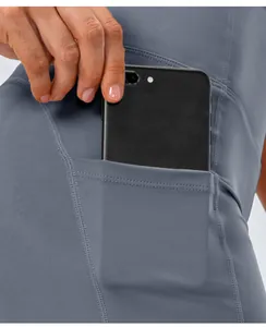 Detail of high-stretch yoga shorts featuring a functional side pocket for a smartphone