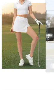 Women's white golf sportswear detail showing a split-hem skirt and polo shirt set
