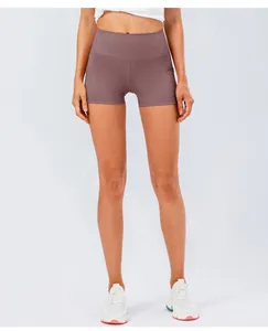 Detail of high waisted purple yoga shorts featuring side pocket and slimming fit