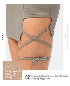 Detail view of sage green ribbed knit skirt with side lace-up cutout and bow tie