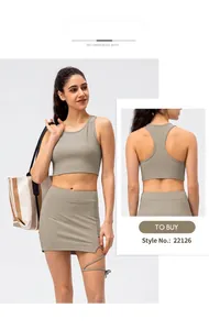 Detail of ribbed knit tennis skirt set in sage green showing fabric texture and back view