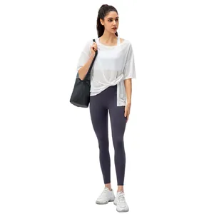 Witte sporttop voor dames met paarse yoga legging met hoge taille voor hardlopen