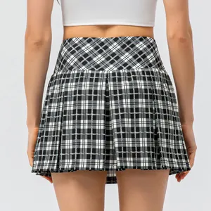 Plaid high-waisted pleated tennis skirt in black and white checked pattern back view