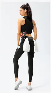 Detail view of high waist yoga leggings with functional pockets for towels and water bottles