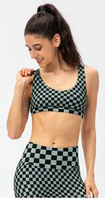 Detail of the high-waisted checkerboard leggings with stretchy blue and black fabric