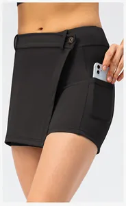 Detail view of black athletic skort featuring a functional side pocket for phone storage