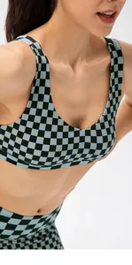Detail of checkered sports bra with cross-color pattern and premium fabric texture