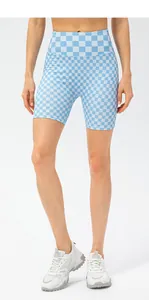 Front view of high waist checkered sports shorts for women in light blue and white