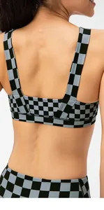 Detailed back view of checkered sports bra with racerback design and padded support