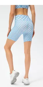 Rear view of high-waisted blue checkerboard yoga shorts with lifting seam details