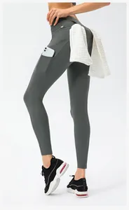 Detail showing high waist yoga pants with phone pocket and back towel loop holder